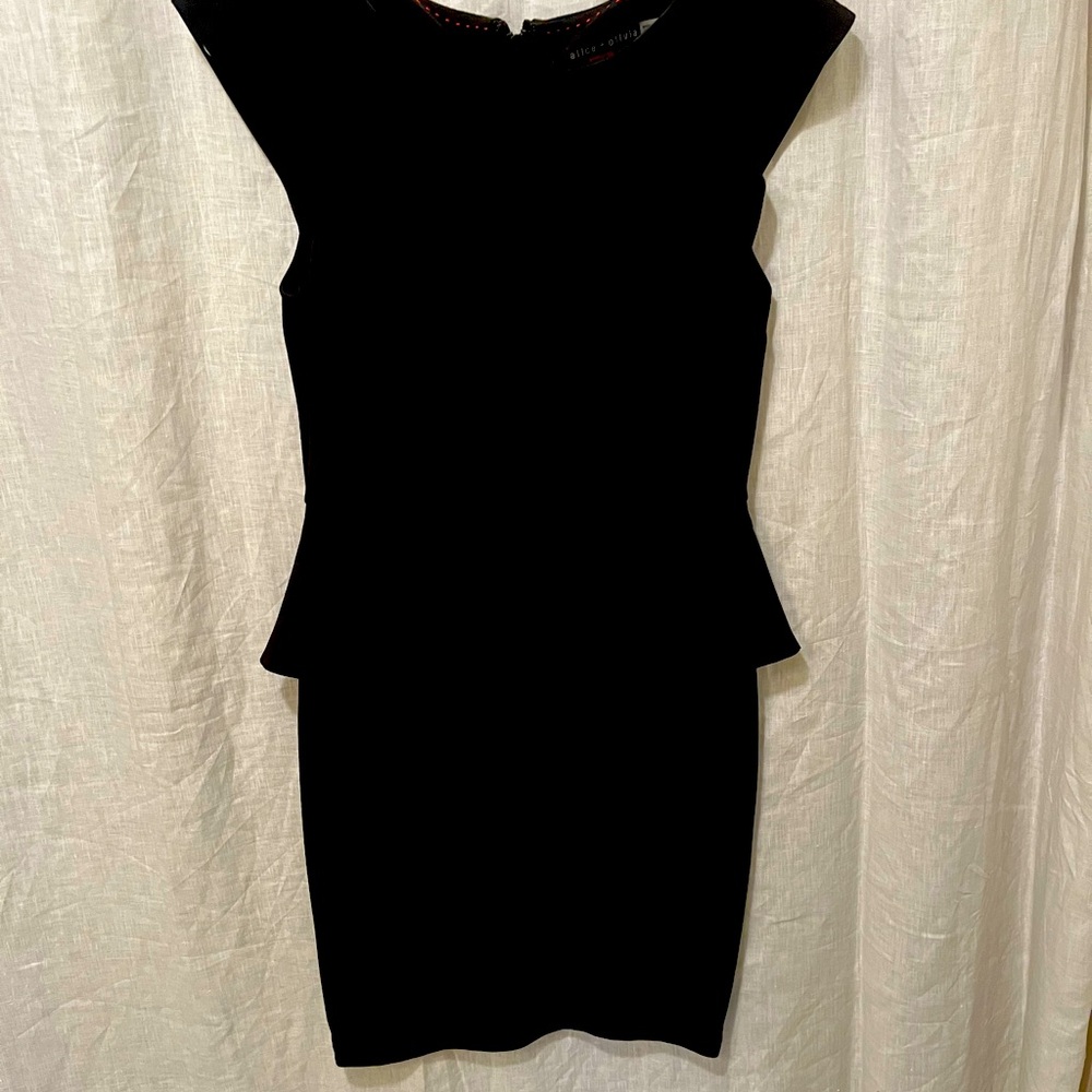 Alice and Olivia black peplum dress. Size 10 but fits like a size 8.